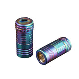 Multicolored metal flashlight on a white background